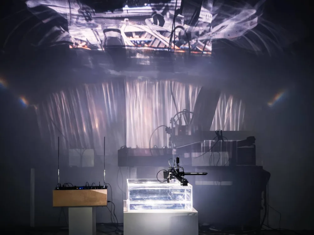 Drifting in Currents of Currents: A Hydro-Acoustic Interface for Gesture-Driven Neural Sound Synthesis and Entropic Memory
